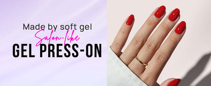 Hand with red nail polish wearing gel press-ons on a light background