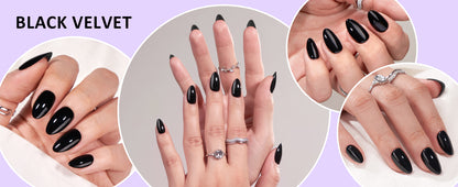 Close-up of hands with black nail polish and rings on a light purple background