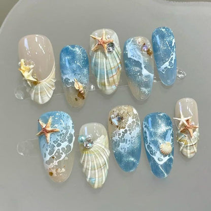 Blue seaside false nails, decorated false nails, seashell nail art, starfish nails, ocean-inspired nails, coastal nail designs, beach themed nails, Australian nail art VXN Beauty