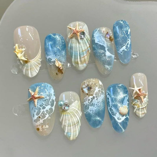 Blue seaside false nails, decorated false nails, seashell nail art, starfish nails, ocean-inspired nails, coastal nail designs, beach themed nails, Australian nail art VXN Beauty