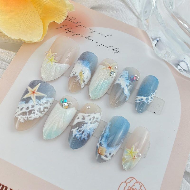 Blue seaside false nails, decorated false nails, seashell nail art, starfish nails, ocean-inspired nails, coastal nail designs, beach themed nails, Australian nail art VXN Beauty