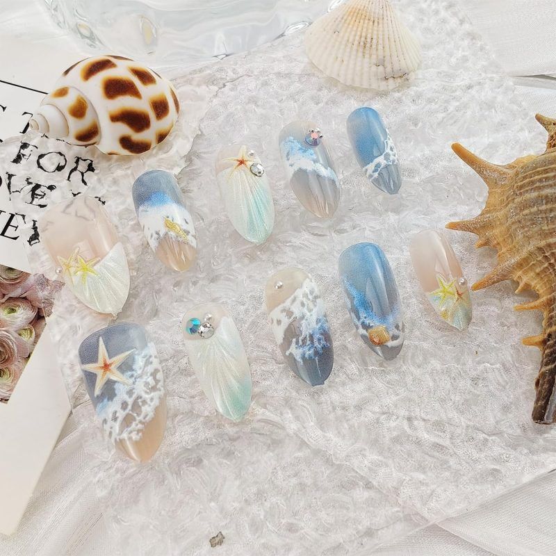 Blue seaside false nails, decorated false nails, seashell nail art, starfish nails, ocean-inspired nails, coastal nail designs, beach themed nails, Australian nail art VXN Beauty