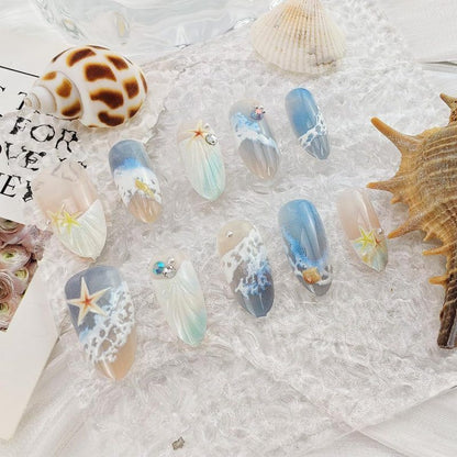 Blue seaside false nails, decorated false nails, seashell nail art, starfish nails, ocean-inspired nails, coastal nail designs, beach themed nails, Australian nail art VXN Beauty